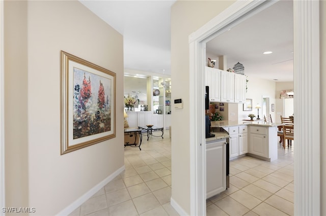 hallway with light tile patterned floors