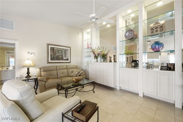 tiled living room featuring ceiling fan