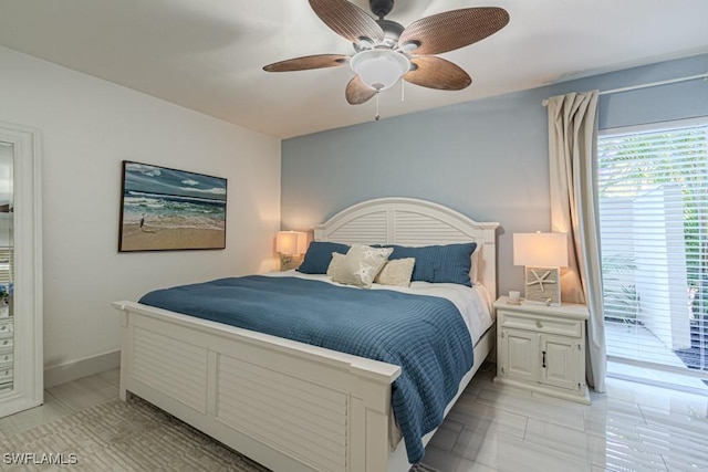 bedroom featuring baseboards and a ceiling fan