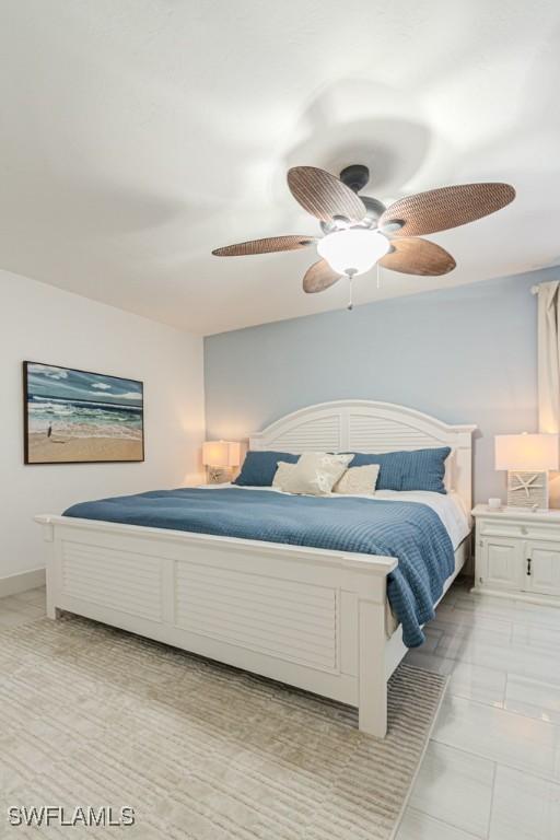 bedroom featuring baseboards and a ceiling fan