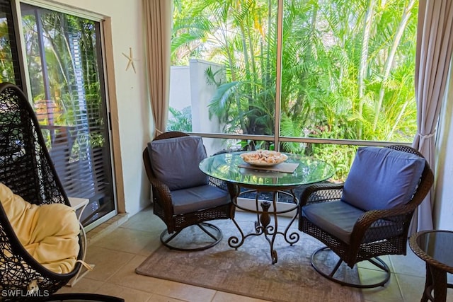 sunroom / solarium featuring a healthy amount of sunlight