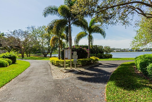 view of home's community featuring a water view and mail area