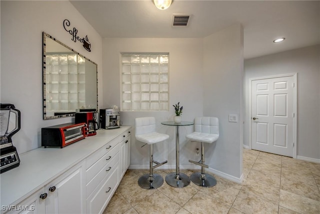 bathroom with tile patterned floors