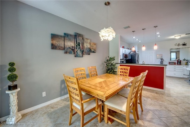 dining area featuring light tile patterned floors