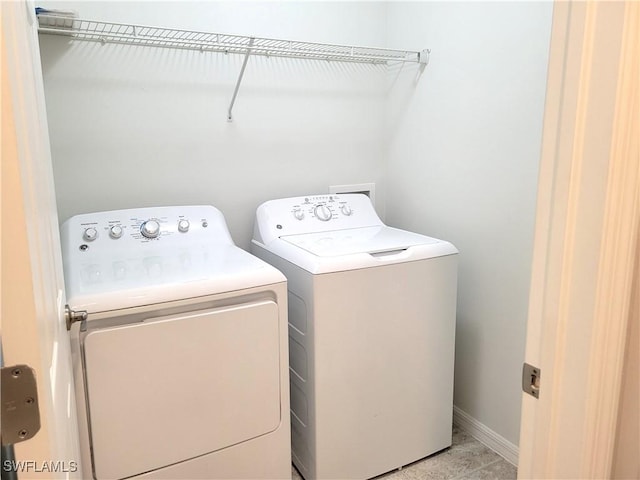 washroom with washer and dryer