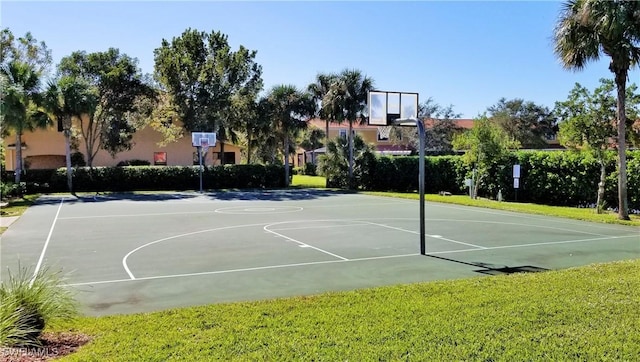 view of basketball court featuring a yard