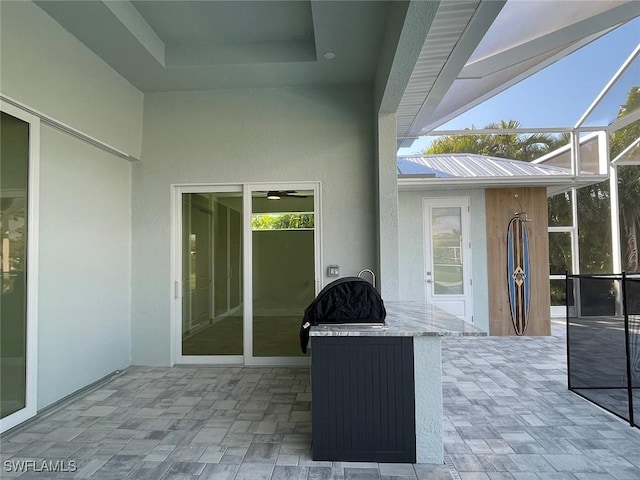 view of patio with glass enclosure