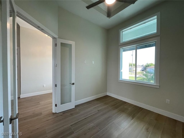 unfurnished room with wood-type flooring and ceiling fan