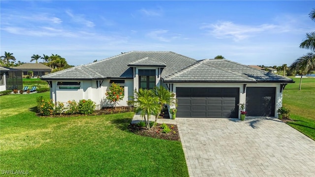 view of front of house with a garage and a front yard