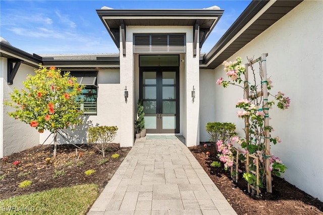 property entrance featuring french doors