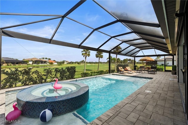 view of swimming pool featuring a lanai and a patio area