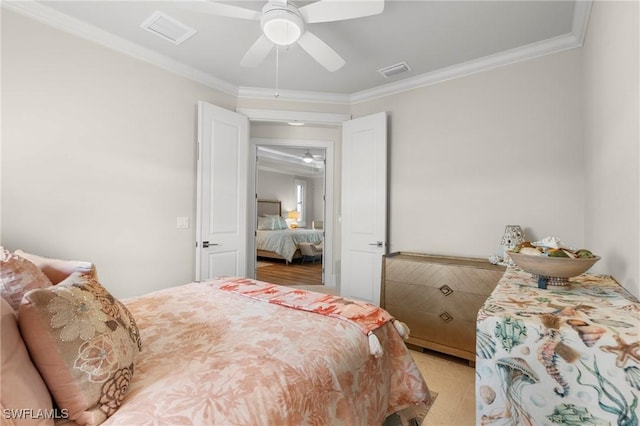 bedroom with ceiling fan and ornamental molding