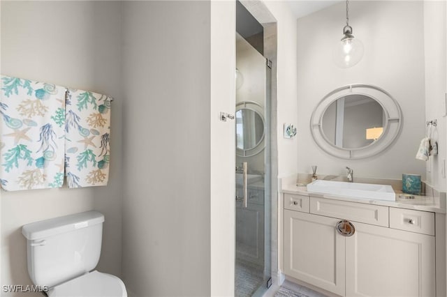 bathroom with vanity and toilet