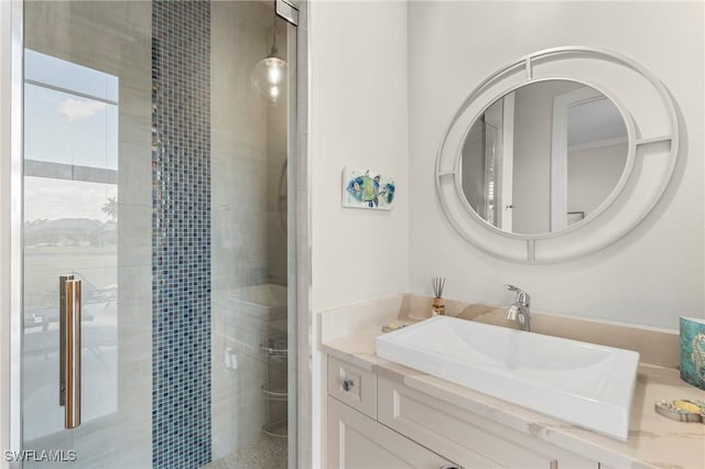 bathroom with vanity and an enclosed shower