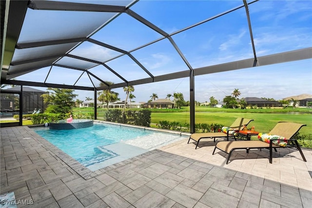 view of pool featuring a lawn, glass enclosure, and a patio area