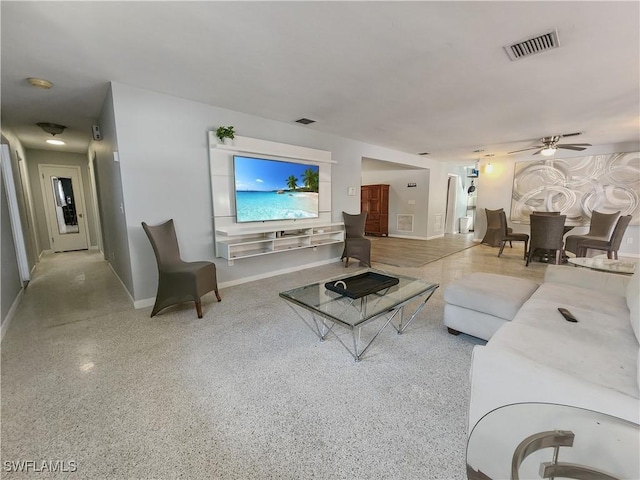 living room featuring ceiling fan