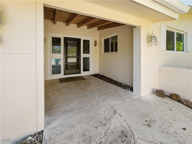 doorway to property featuring a patio