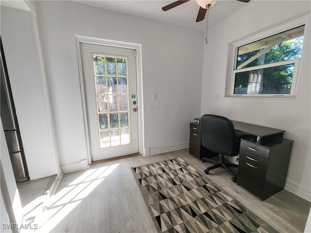 office area with ceiling fan and light wood-type flooring