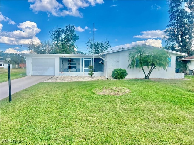 single story home featuring a garage and a front yard