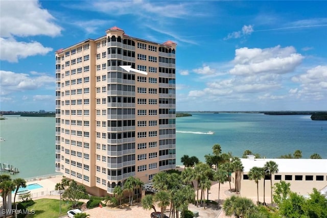 view of building exterior with a water view