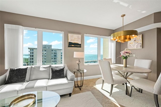 dining room featuring a water view