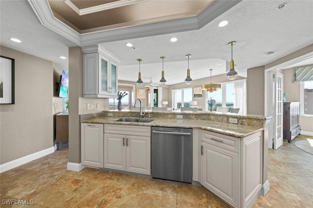 kitchen with sink, white cabinetry, ornamental molding, a tray ceiling, and dishwasher