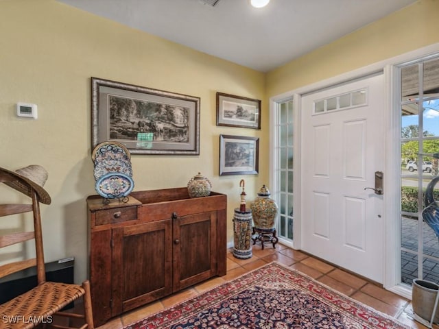 foyer entrance with light tile patterned floors