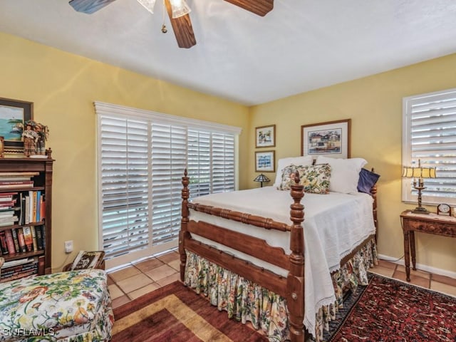 bedroom with ceiling fan and light tile patterned floors