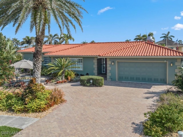 ranch-style home featuring a garage