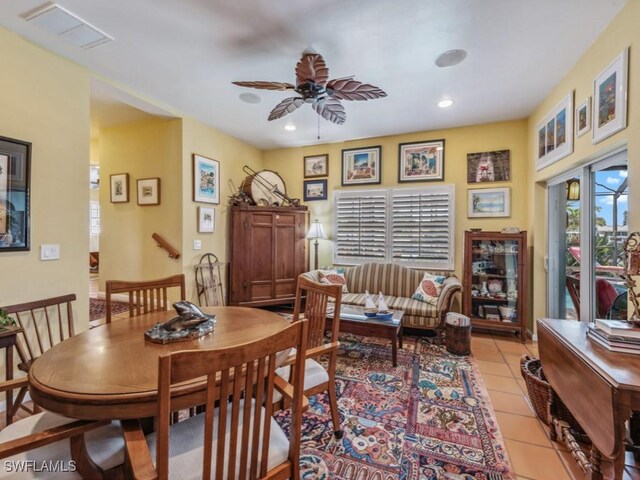 tiled dining area featuring ceiling fan