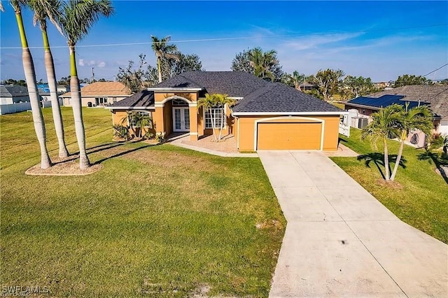 ranch-style home featuring a garage and a front yard