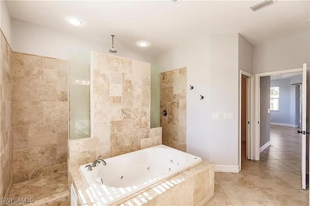 bathroom featuring tile patterned floors and separate shower and tub