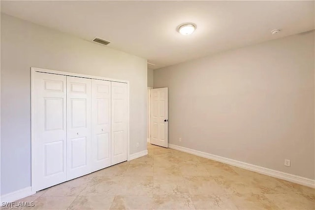 unfurnished bedroom featuring a closet