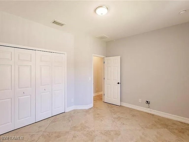 unfurnished bedroom featuring a closet