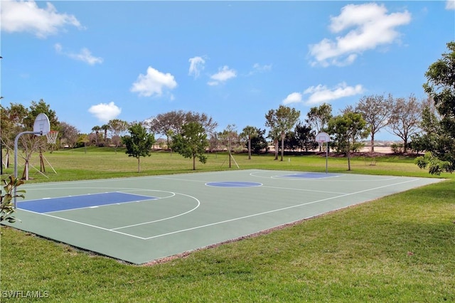 view of basketball court featuring a yard