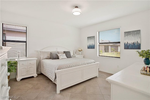 bedroom featuring light tile patterned flooring