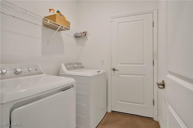 clothes washing area featuring washing machine and dryer