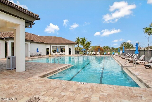 view of swimming pool featuring a patio