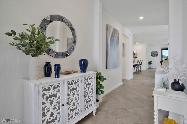 hallway featuring light tile patterned flooring