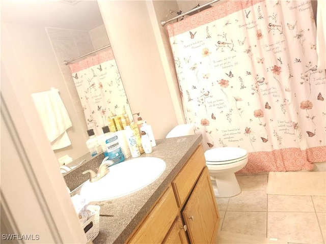 bathroom with a shower with shower curtain, vanity, toilet, and tile patterned flooring