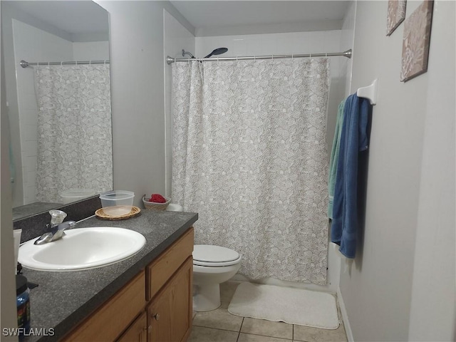 bathroom with vanity, curtained shower, tile patterned floors, and toilet