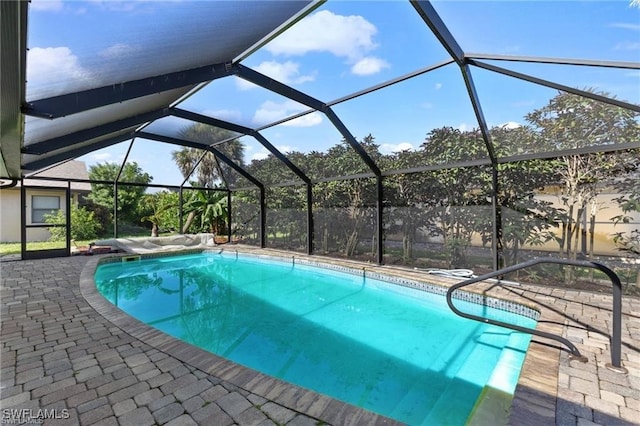 view of pool with a lanai and a patio area