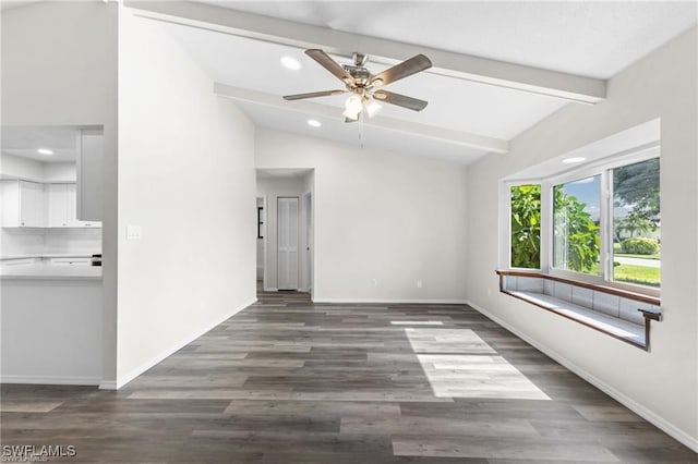 spare room featuring ceiling fan, vaulted ceiling with beams, and dark hardwood / wood-style floors