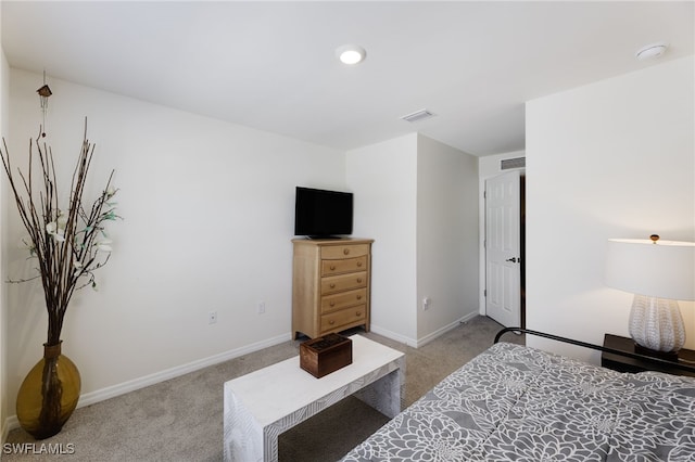 bedroom with light carpet