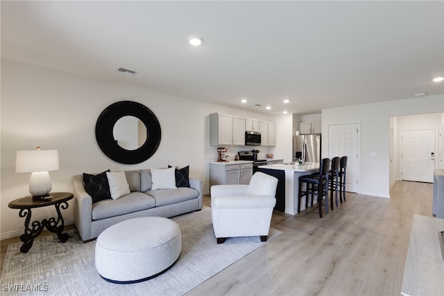 living room featuring light hardwood / wood-style flooring