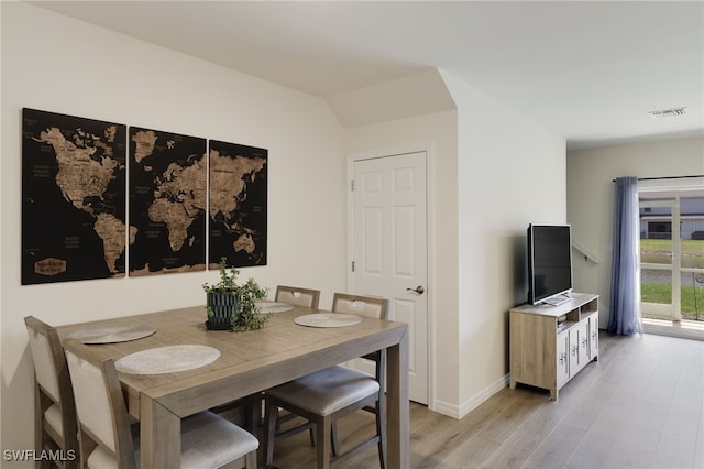 dining space featuring light wood-type flooring