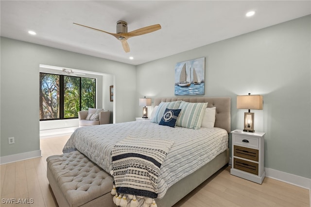 bedroom with ceiling fan and light hardwood / wood-style flooring