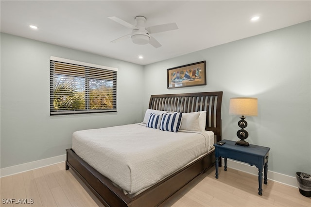 bedroom with ceiling fan and light wood-type flooring