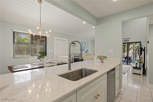 kitchen featuring sink, white cabinetry, light stone counters, dishwasher, and pendant lighting