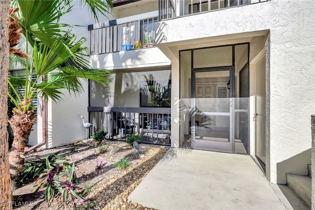 entrance to property with a balcony